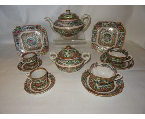 A 20th Century Chinese Tea and Coffee Set decorated with flowers, symbols etc comprising eleven tea cups, twelve saucers, twe