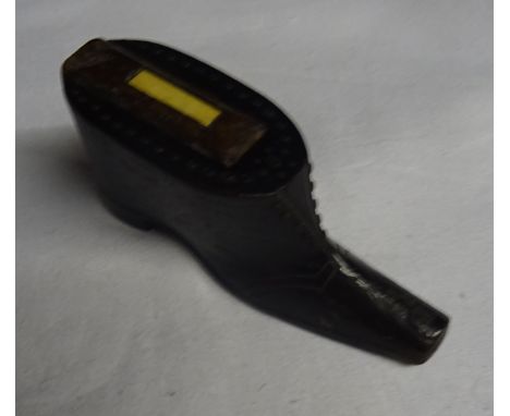 A 19th Century wooden Snuff Box in the form of a shoe with stud work decoration.  3 1/2" (9cms) wide.