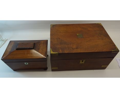 A mid 19th Century mahogany sarcophagus shaped Tea Caddy the interior fitted with two covered containers and a Victorian tabl