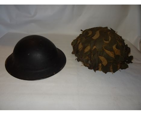 A 1941 British Steel Helmet and a Paratrooper's helmet.
