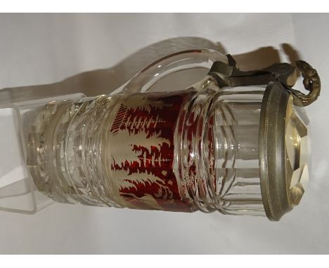 A Bohemian ruby flash lidded Stein decorated with a landscape panel with a stag etc. and with metal mounts.