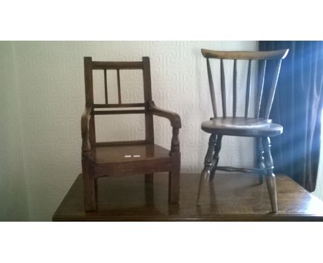 A Child's 19th Century oak elbow Chair and a child's stick back chair.