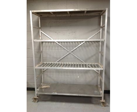 An aluminium four tier trolley / shelf on castors, width 148 cm 