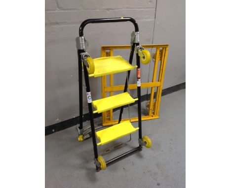 A metal piano dolly, folding sack barrow/step ladder on castors 