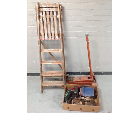 A wooden step ladder, a car jack together with box of power and hand tools, Prinz binoculars, Record woodworking plane