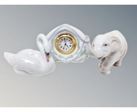 A Lladro swan, elephant and a quartz mantel timepiece (3) 