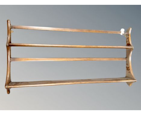 An Ercol stained elm plate rack width 96 cm 