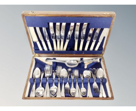 An oak canteen of stainless steel cutlery 
