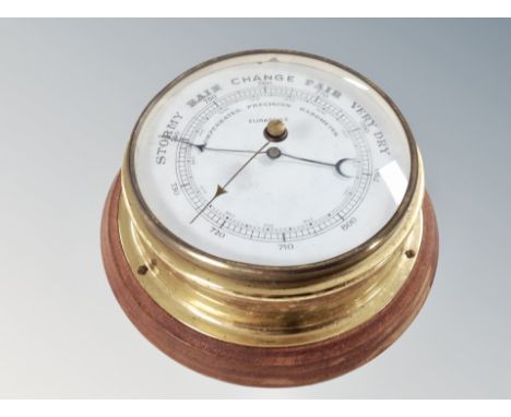 A brass circular barometer 