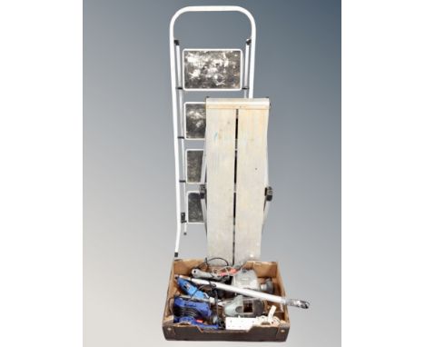 A four tread folding step ladder together with a further aluminium platform, a box containing dremel, glue gun and other powe