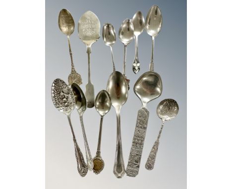 Three silver teaspoons, several plated examples and a brass crucifix 