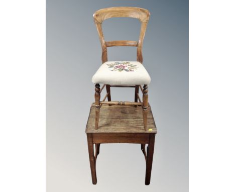 An antique oak school desk together with a chair with tapestry seat 
