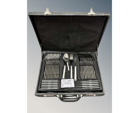 A leather cased canteen of stainless steel cutlery 