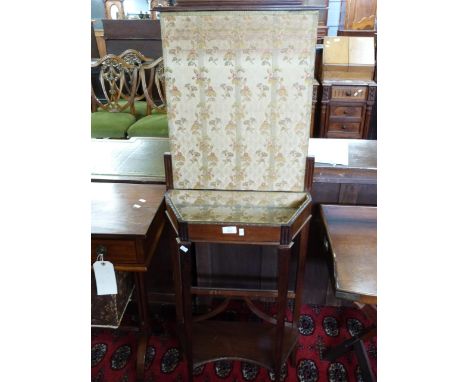 Unusual late 19th century small mahogany framed sewing table, the back with a rising fabric covered screen, raised on taperin