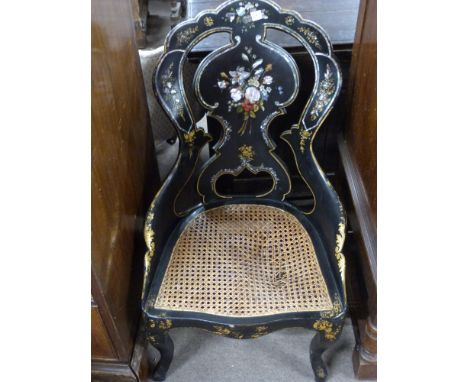 Victorian black lacquer and mother of pearl inlaid side chair, with cane seat, raised on cabriole legs, 82cm high