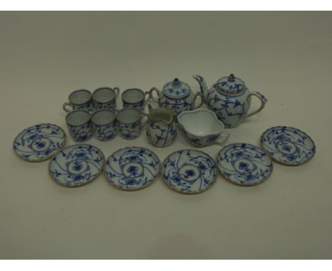 Miniature tea set with a blue design in Meissen style comprising small tea pot, sucrier and cover, milk jug and 6 cups and sa