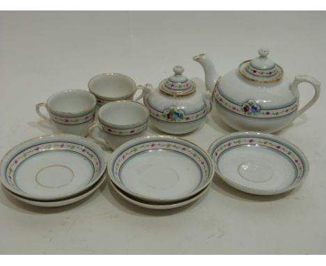 Miniature 19th century child's tea set comprising tea pot, sugar bowl and three cups and saucers