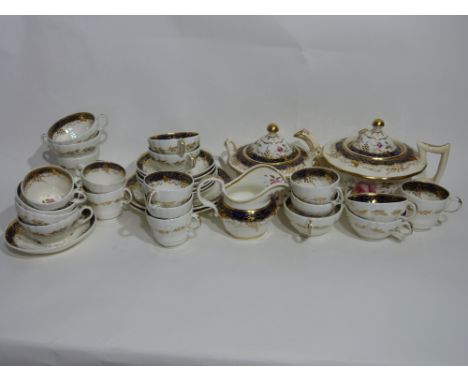 19th century English porcelain tea set, possibly Derby, decorated to the interior with a blue border and gilt design and flor