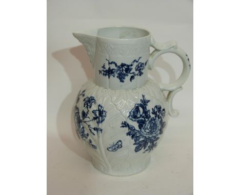 Large 18th century Worcester porcelain mask jug decorated with floral sprays on a moulded cabbage body (hairlines), 31cm high