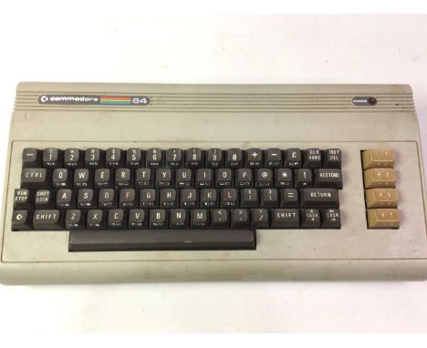 COMMODORE 64, console, controller, power unit and a selection of game cartridges