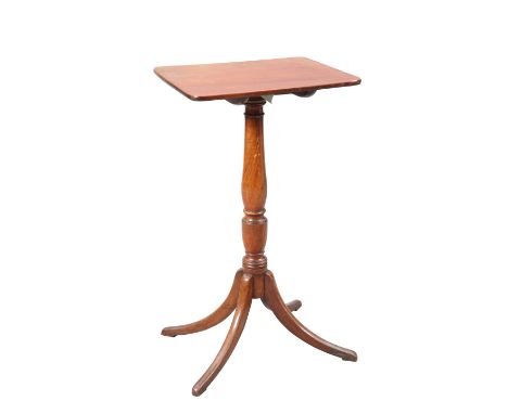 A GEORGE III MAHOGANY TILT-TOP TRIPOD TABLE, the hinged rectangular top with rounded corners, raised on a vasi-form stem with