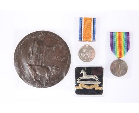 A WWI DEATH PLAQUE, MEDAL PAIR AND CAP BADGE, 25936 Pte. J.W. Greenwood W. York R.