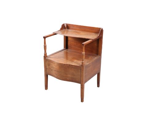 A GEORGE III LANCASHIRE MAHOGANY COMMODE, PROBABLY BY GILLOWS, with serpentine front and hinged seat cover.