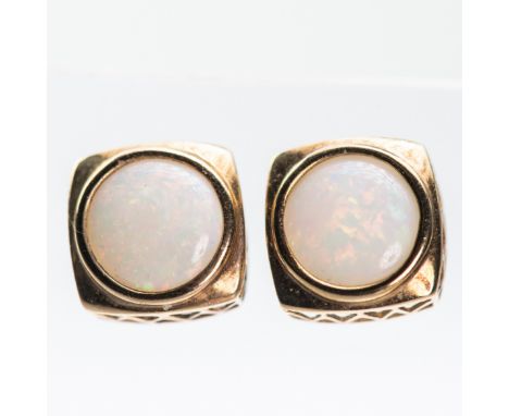 A PAIR OF 9CT YELLOW GOLD AND OPAL STUD EARRINGS, set with round cut opals, stamped 375; together with a further pair of opal