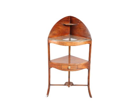 A GEORGE III MAHOGANY CORNER WASHSTAND, bow-fronted, the shelf with drawer. 114cm high