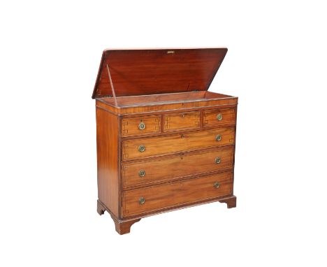 A REGENCY MAHOGANY CHEST OF DRAWERS WITH HINGED TOP, with reeded quarter-column corners and three short over three long gradu