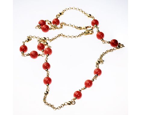 18CT YELLOW GOLD AND CORAL NECKLACE, the fifteen coral beads set evenly into five sections onto a fine oval link chain with b