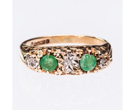 AN EMERALD AND DIAMOND RING, the two emerald and three diamond highlights set in an elaborate pierced scroll detail mount bet