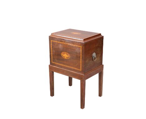 AN EDWARDIAN INLAID MAHOGANY WINE COOLER, the hinged rectangular top centred by an inlaid oval of an urn, the front similarly