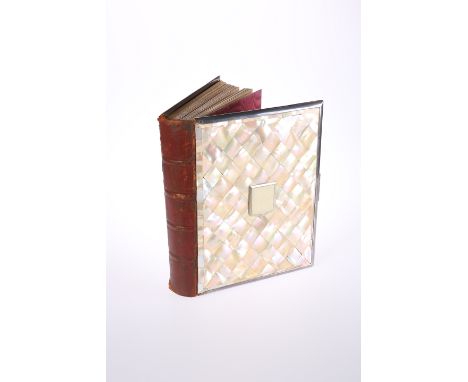 A LATE VICTORIAN MOTHER-OF-PEARL PHOTOGRAPH ALBUM, with twenty-three vacant leaves, mounted in silver-plate. 30cm by 24cm