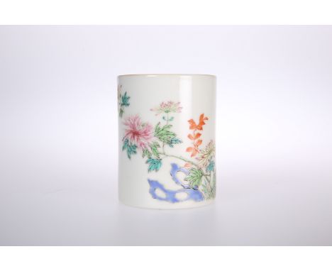 A SMALL CHINESE FAMILLE ROSE PORCELAIN VASE OR BRUSH POT, painted with a flowering bough and with seal marks and calligraphy.