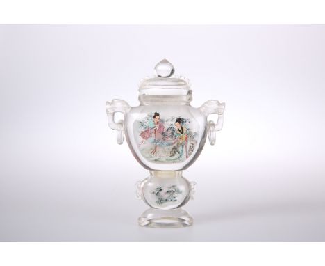 A CHINESE GLASS SNUFF BOTTLE AND COVER, with ring handles, decorated with figures. 12.5cm