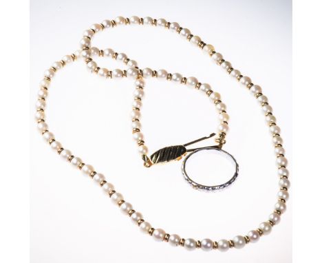 A CULTURED PEARL NECKLACE, together with a single white metal wedding band. Length 46cm. Ring size L.&nbsp;