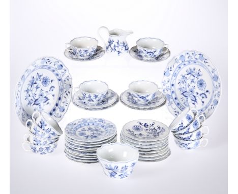 A GROUP OF MEISSEN BLUE AND WHITE "ONION" PATTERN TEA WARES, comprising twelve cups and saucers, twelve tea plates, cream jug