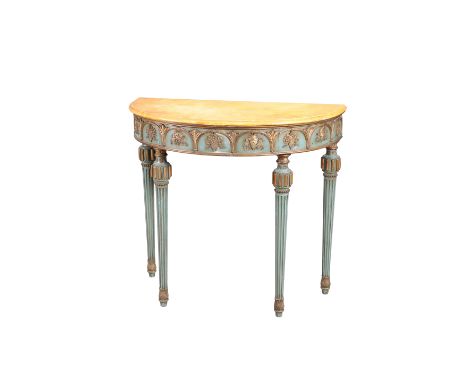 A PAINTED DEMILUNE CONSOLE TABLE, early 20th Century, with faux marble top and frieze of grapes and vines, raised on fluted t