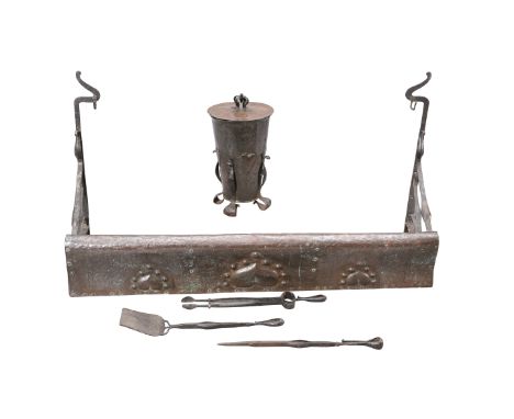 AN ARTS AND CRAFTS COPPER AND WROUGHT IRON FIRE SET, IN THE MANNER OF MACKAY HUGH BAILLIE SCOTT, comprising fender, coal buck