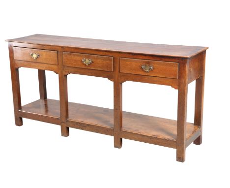 A GEORGE III OAK POTBOARD DRESSER, with three frieze drawers with solid brass backplate handles, raised on square section leg