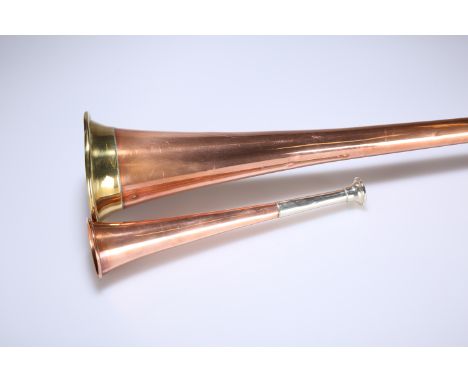 AN EDWARDIAN COPPER COACHING HORN AND A COPPER HUNTING HORN. (2) Coaching horn 121.5cm