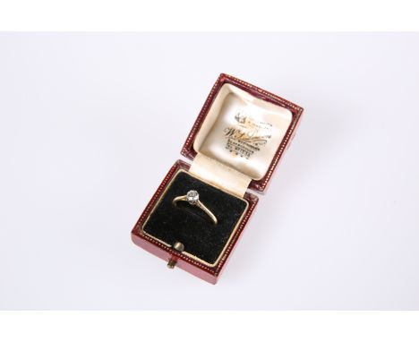 A SINGLE STONE DIAMOND RING, the round brilliant-cut stone claw-set on a tapering 18ct yellow gold band, in a fitted case.