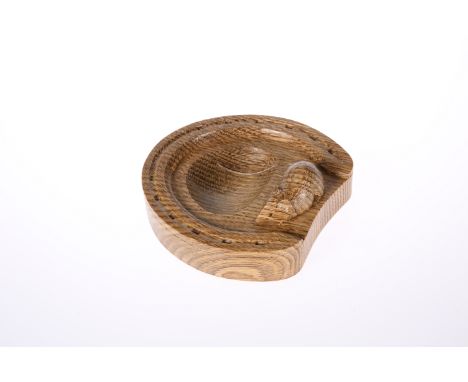 ROBERT THOMPSON OF KILBURNA MOUSEMAN OAK HORSESHOE PIN TRAY, with tiger stripe in the oak, carved mouse signature. 13cm by 12