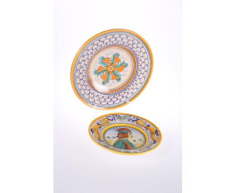 TWO DERUTA FAIENCE PLATES IN RENAISSANCE STYLE, the larger signed M. Sambuco, 32cm; the smaller centred by a painted portrait
