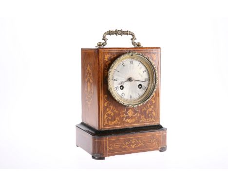 A FRENCH INLAID ROSEWOOD MANTEL CLOCK, 19TH CENTURY, the case with brass carrying handle and plinth base, engine turned silve