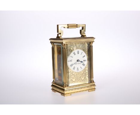 A LATE 19th CENTURY GILT-BRASS CARRIAGE CLOCK, retailed by Mappin &amp; Webb, of characteristic form, the signed enamel dial 