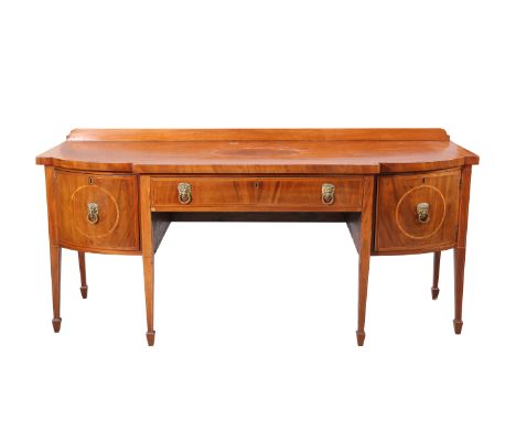 A GEORGE III INLAID MAHOGANY BREAKFRONT SIDEBOARD, the crossbanded and inlaid top above a long frieze drawer flanked by a cup