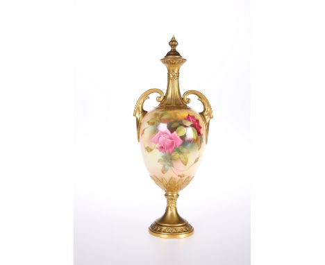 A ROYAL WORCESTER VASE AND COVER, the two-handled ovoid body raised on a pedestal foot, painted with roses, indistinctly sign