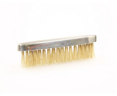 A STERLING SILVER MOUNTED MOUSTACHE BRUSH, with engine turned decoration. 8cm